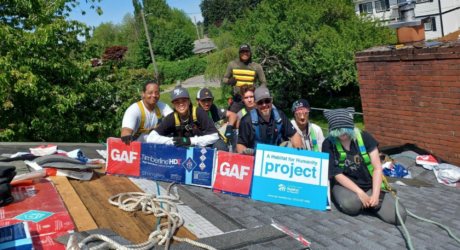 GAF roofing academy students on the roof during a roof replacement project for a senior homeowner.